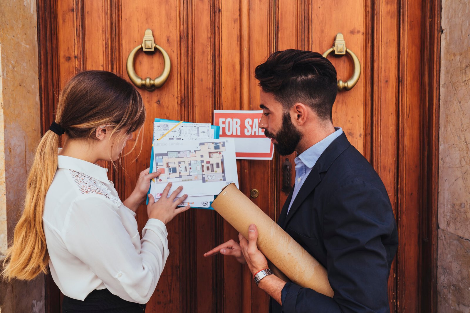 real-estate-agents-working-building-s-main-entrance